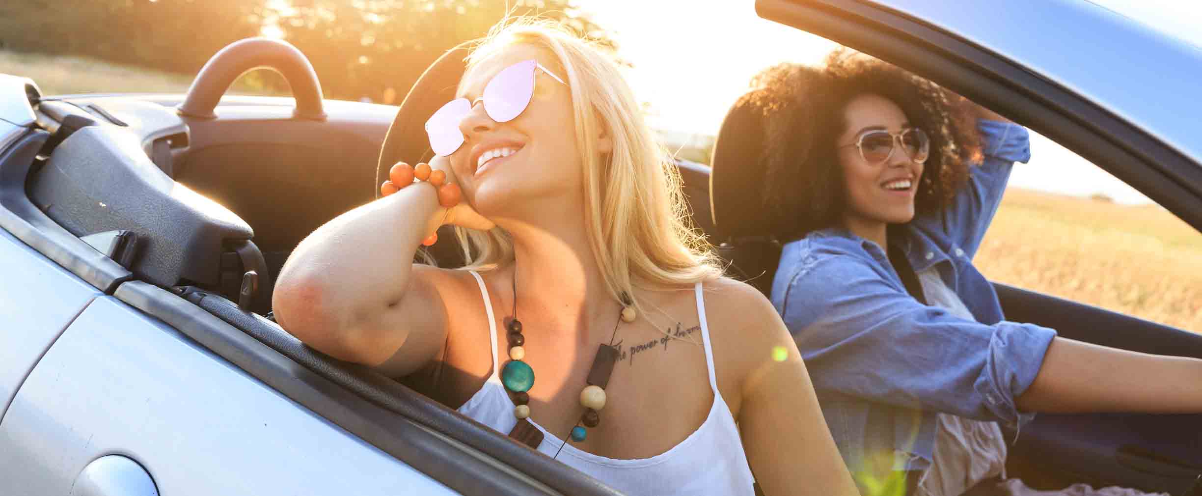 two girls riding in a car